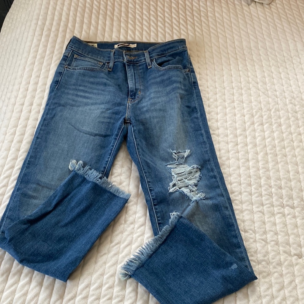 boutique jeans ripped and frayed at ends